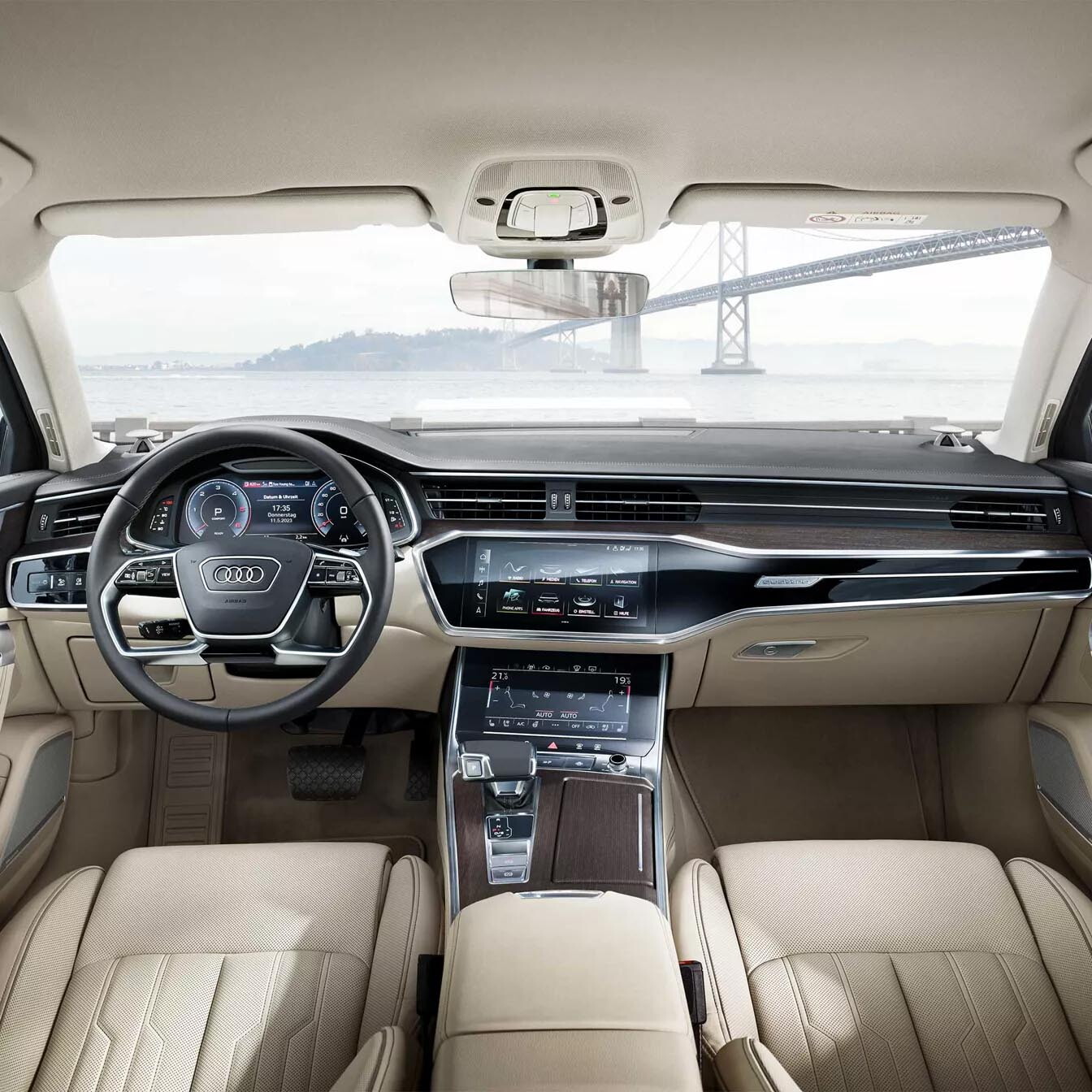 audi a6 berline wit beige interieur met zwart stuur en infotainment