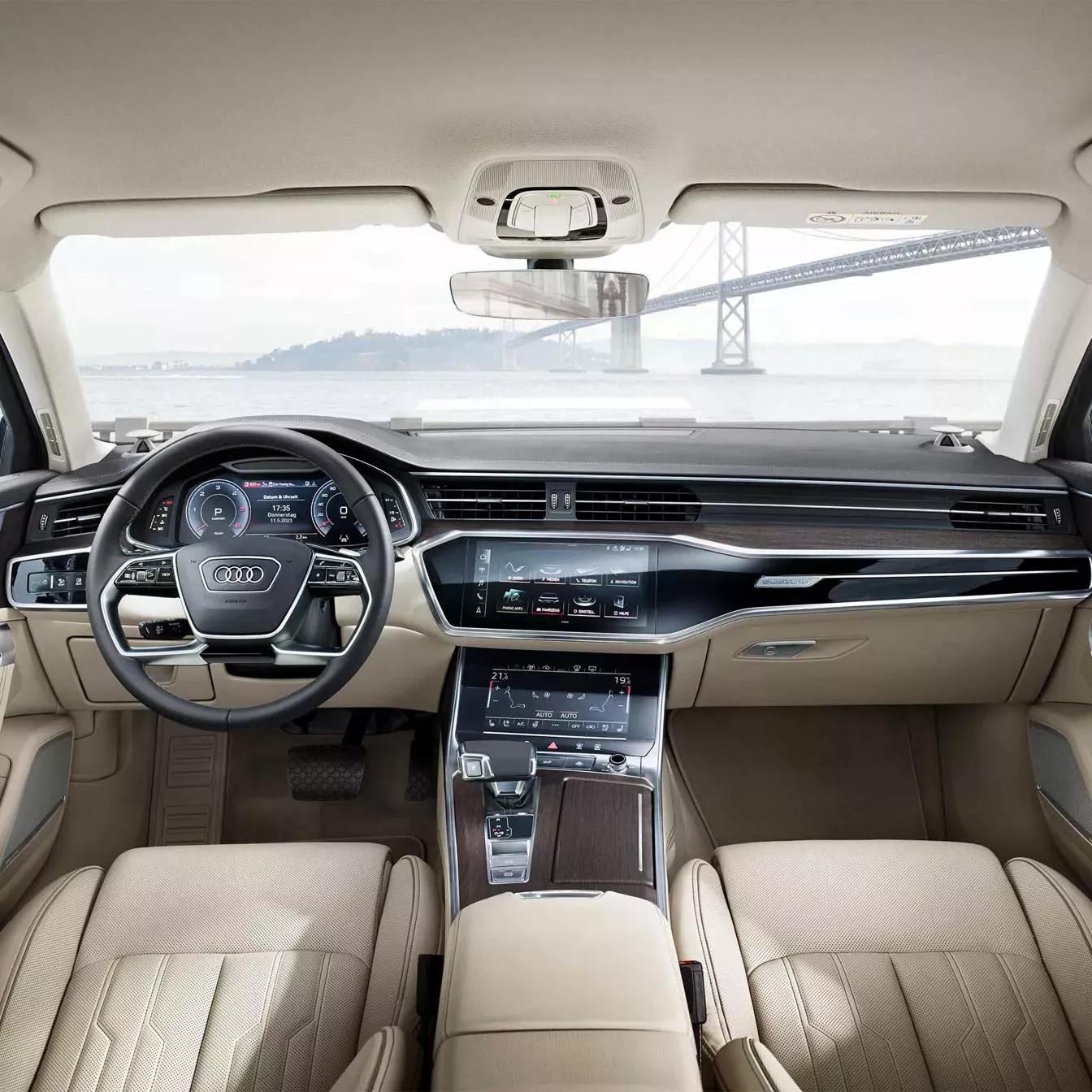 audi a6 berline wit beige interieur met zwart stuur en infotainment